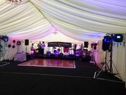 A wedding function band in a marquee.